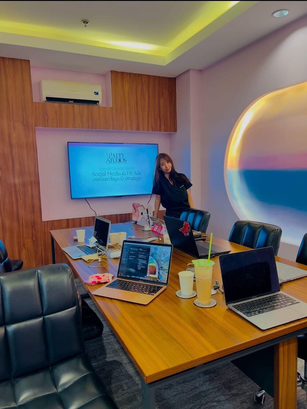 Patty presenting to a client team in a meeting room